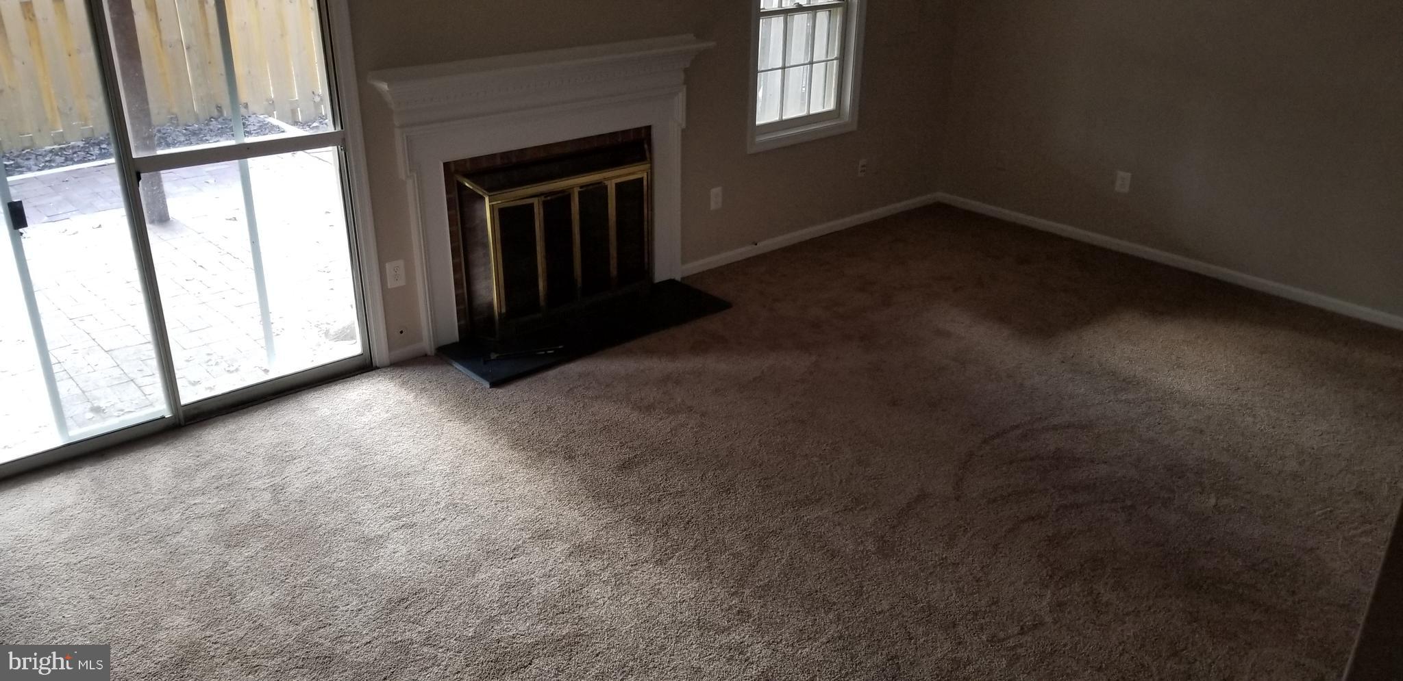 7728 Gromwell Court Springfield, VA 22152 - Photo 14 of 16 Walk out basement with a wood burning fireplace