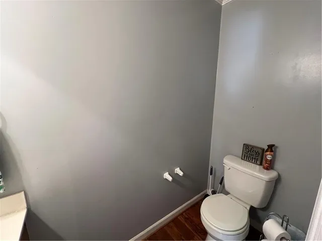 a large kitchen with stainless steel appliances a sink and cabinets