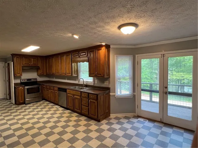 a view of room with window and hallway