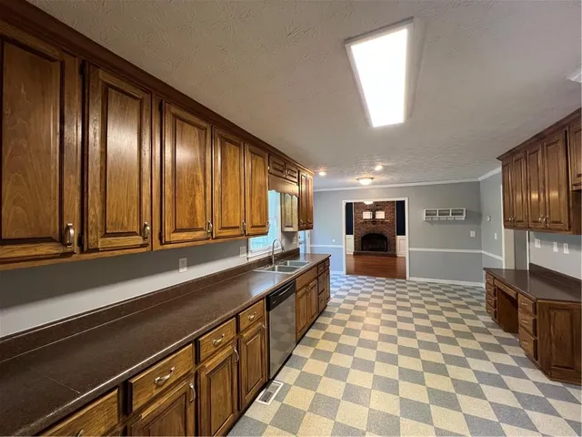 a view of a bedroom with a furniture and a ceiling fan