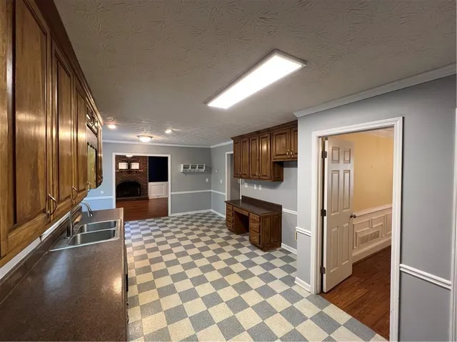 a view of an empty room and a ceiling fan