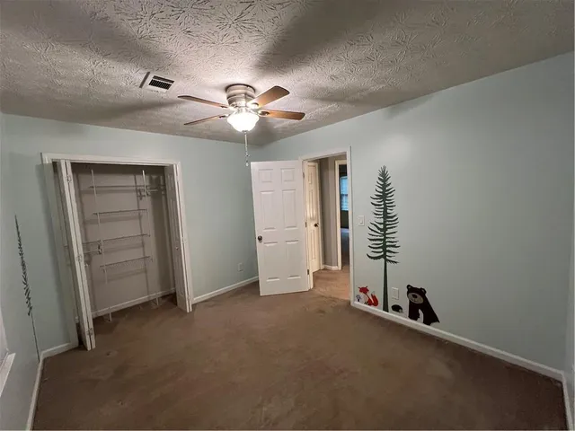 a spacious bathroom with a double vanity sink and mirror
