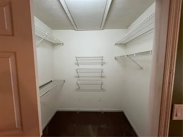 a view of an empty room with a fireplace