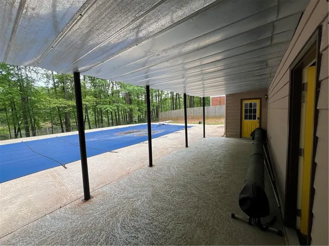 a view of a street with a tree