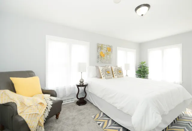 a bedroom with a bed and a couch