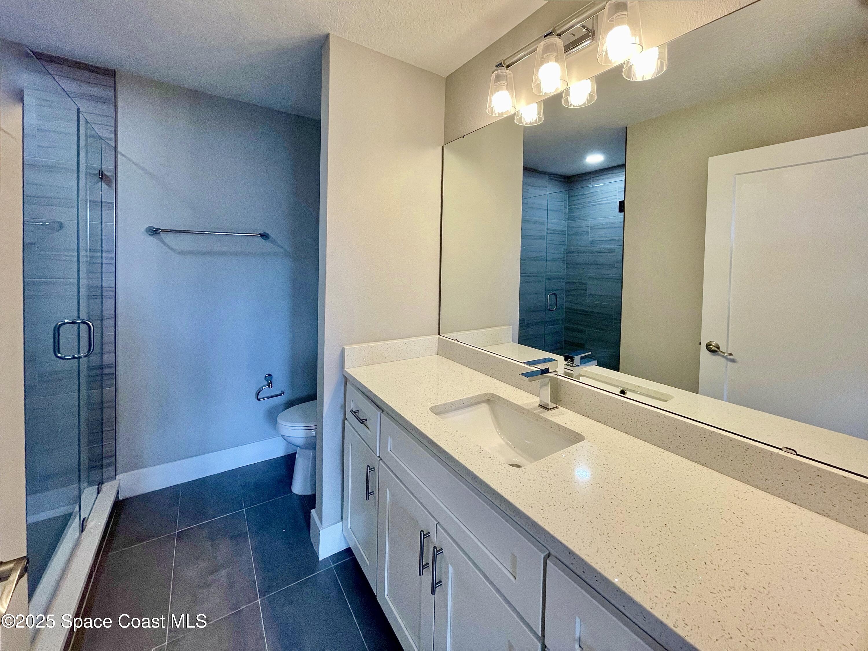 890 Florida Avenue Cocoa, FL 32922 - Photo 19 of 63 a bathroom with a sink a toilet and shower