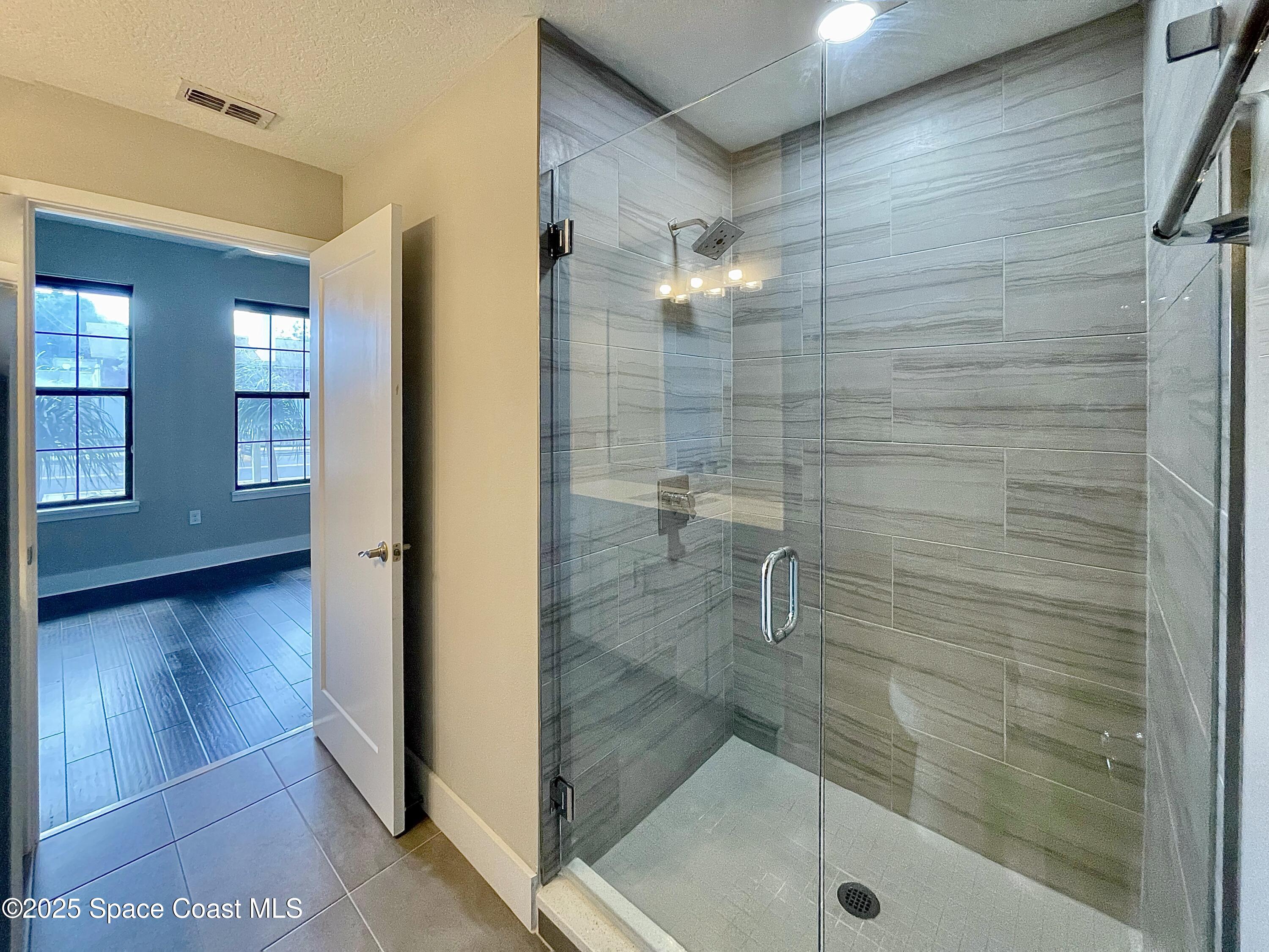 890 Florida Avenue Cocoa, FL 32922 - Photo 20 of 63 a bathroom with a shower