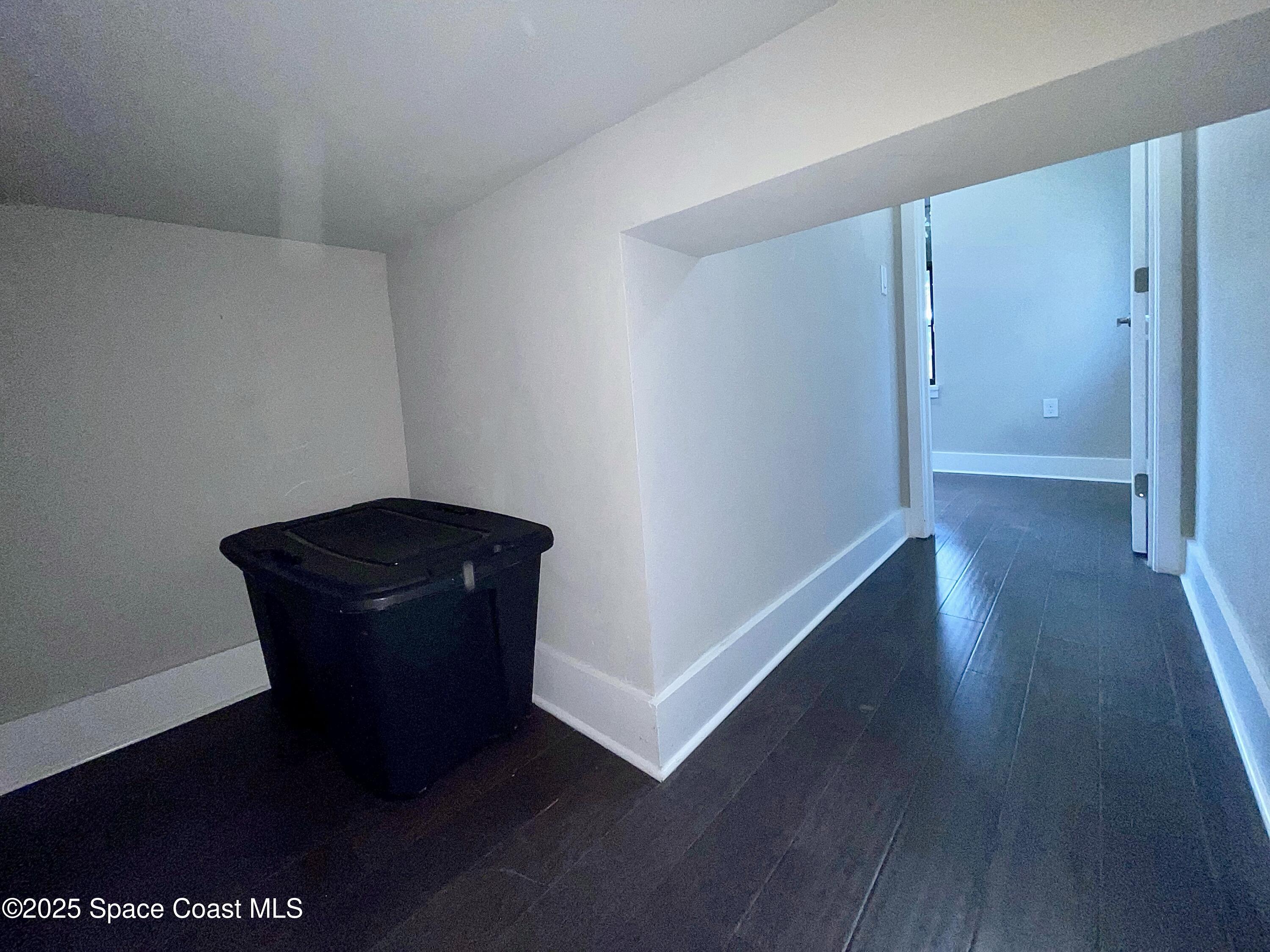 890 Florida Avenue Cocoa, FL 32922 - Photo 23 of 63 a room with a wooden floor