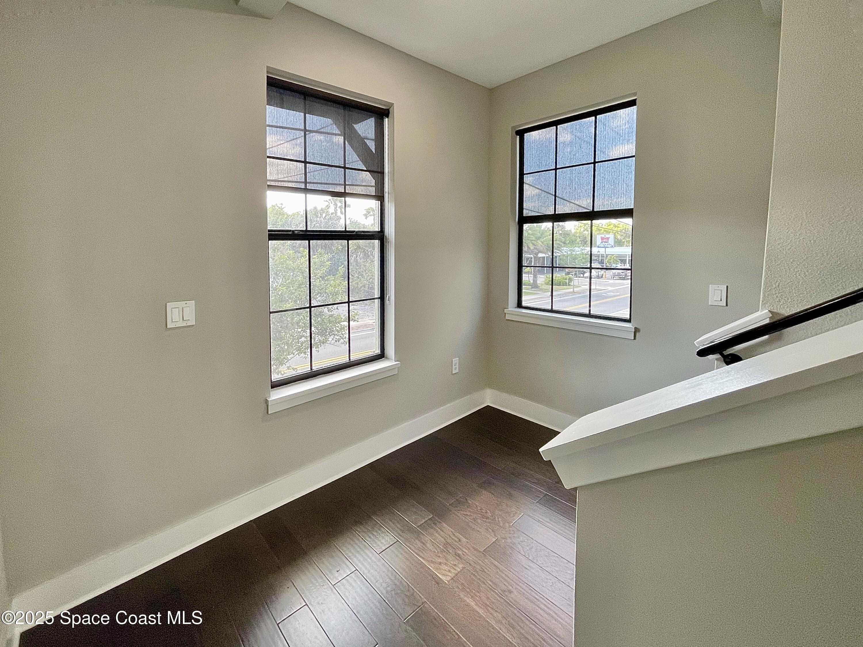 890 Florida Avenue Cocoa, FL 32922 - Photo 29 of 63 a view of an empty room with wooden floor and a window