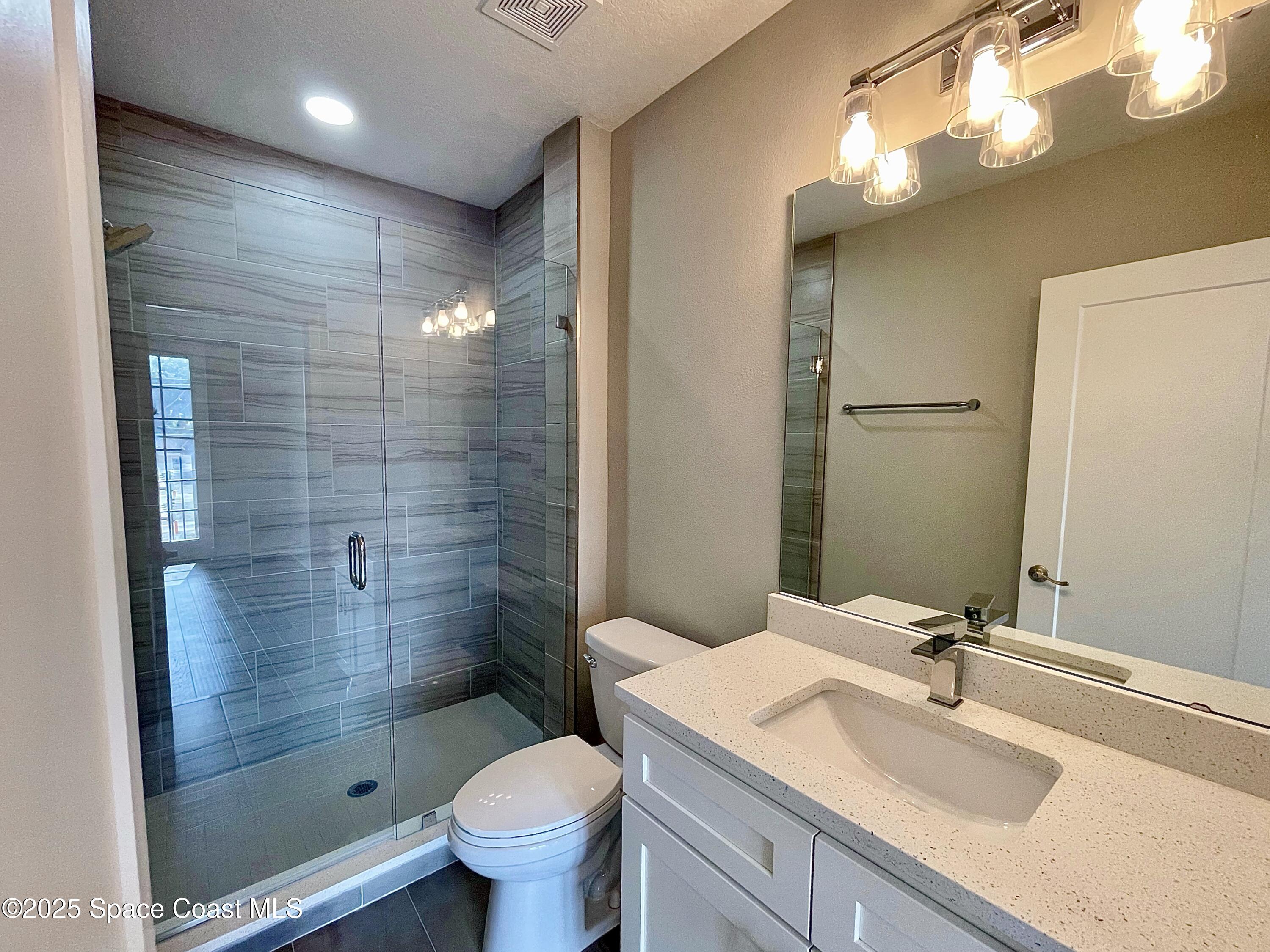 890 Florida Avenue Cocoa, FL 32922 - Photo 32 of 63 a bathroom with a sink a toilet and shower