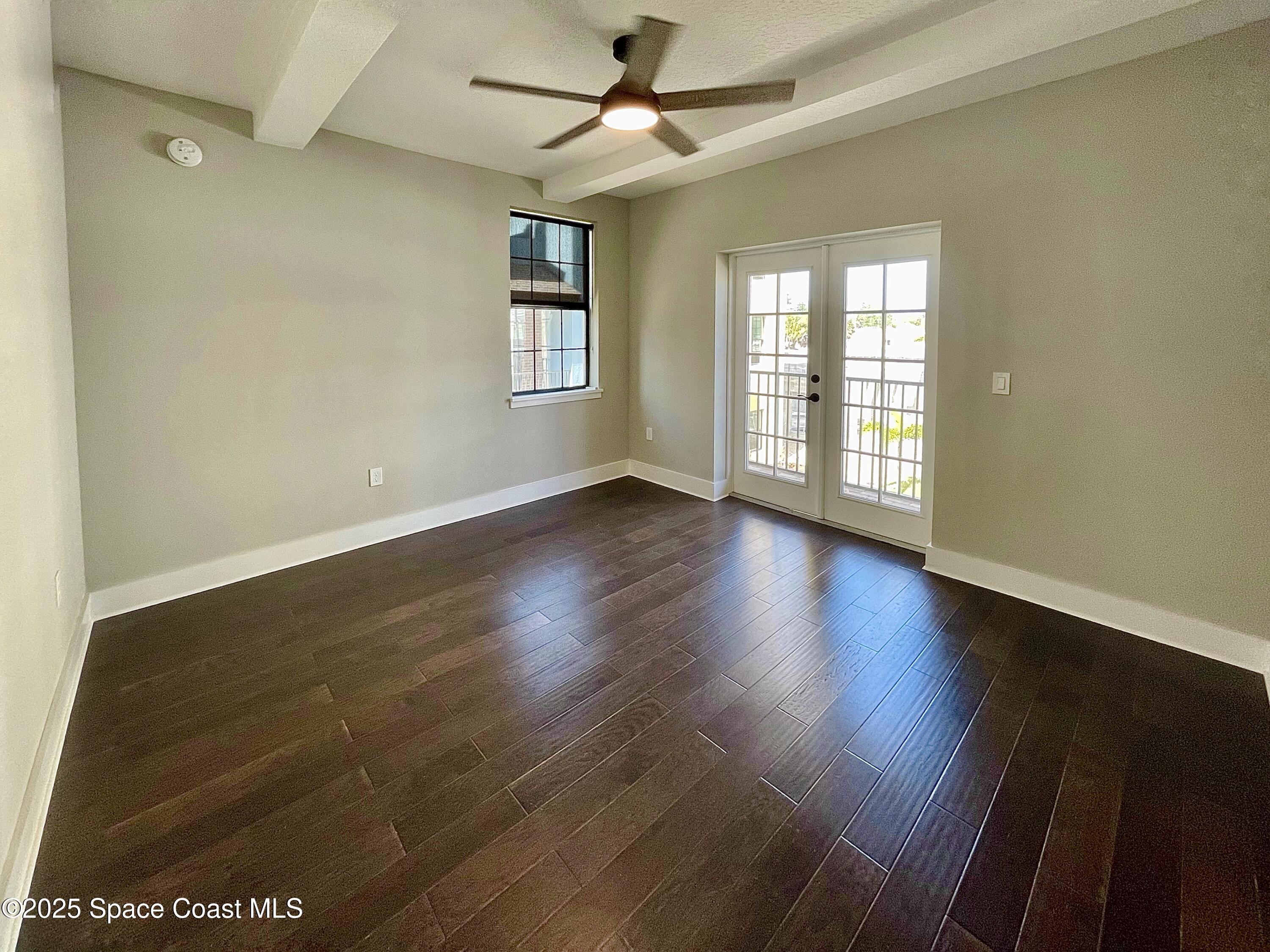 890 Florida Avenue Cocoa, FL 32922 - Photo 36 of 63 wooden floor in an empty room with a window