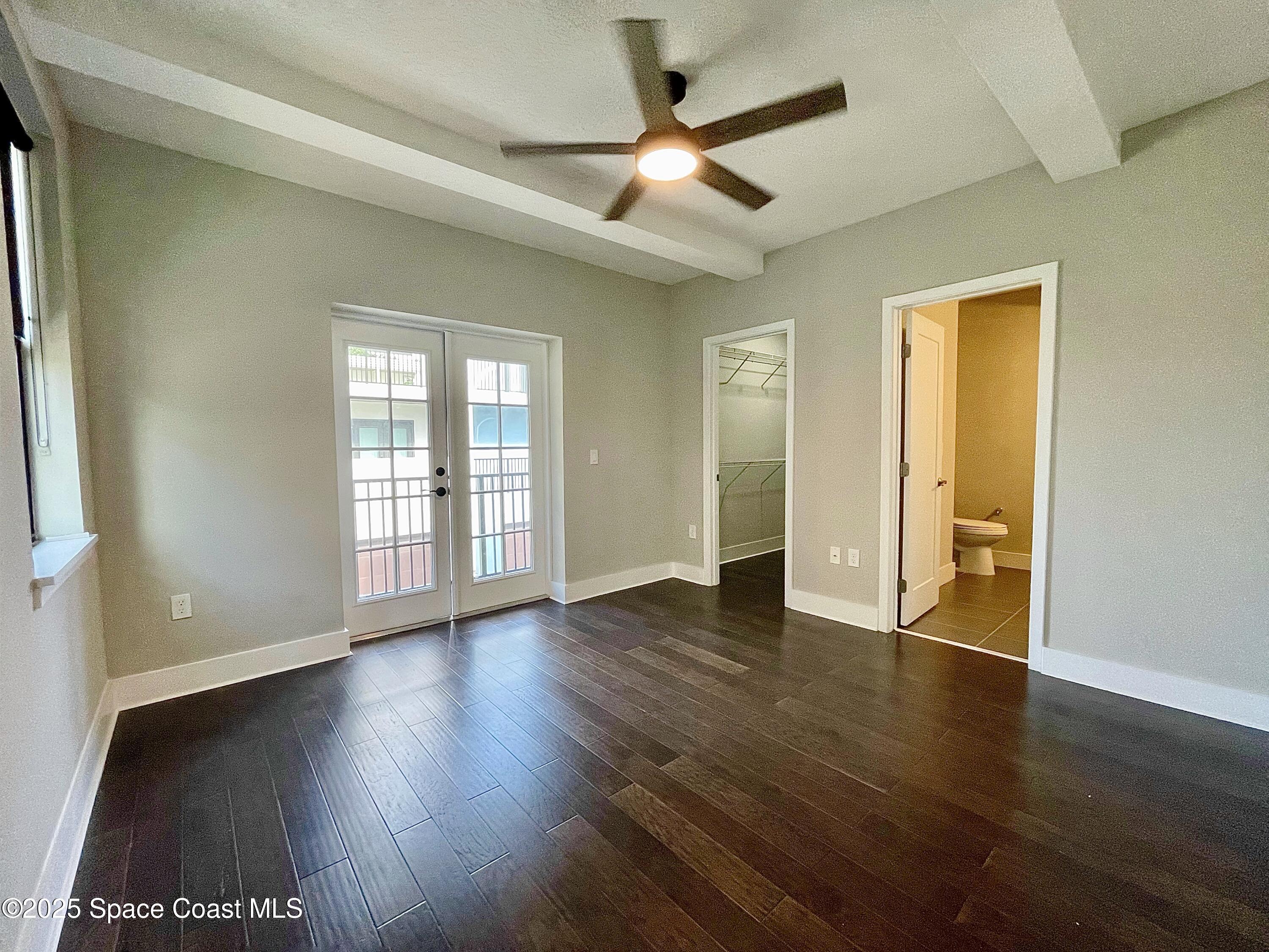 890 Florida Avenue Cocoa, FL 32922 - Photo 37 of 63 a view of an empty room with window and wooden floor