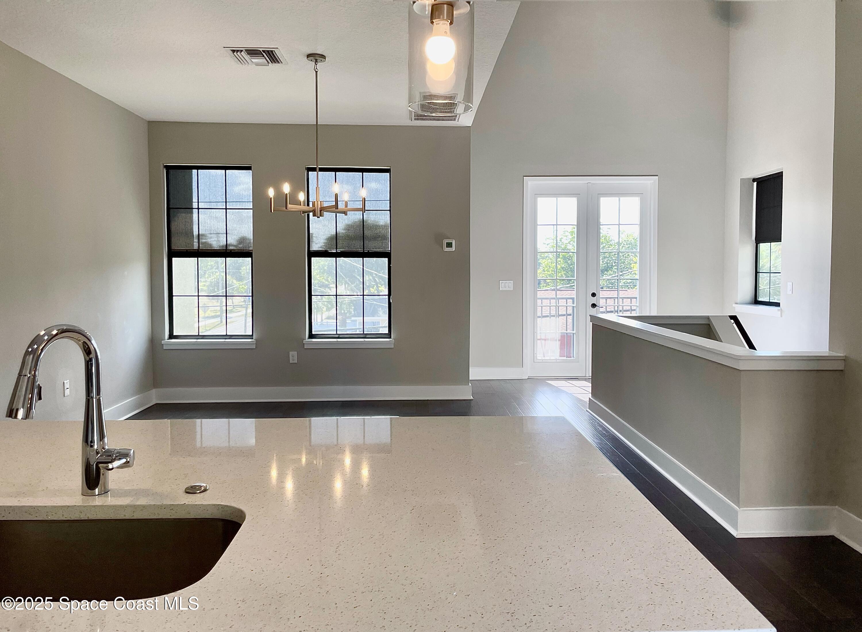 890 Florida Avenue Cocoa, FL 32922 - Photo 44 of 63 a view of a kitchen with a sink and chandelier