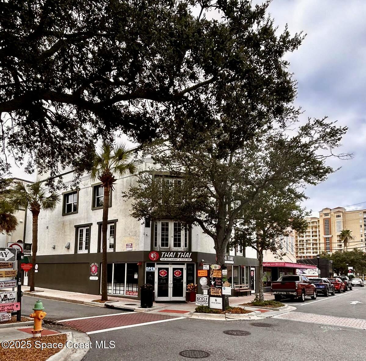 890 Florida Avenue Cocoa, FL 32922 - Photo 55 of 63 a city street lined with buildings and cars