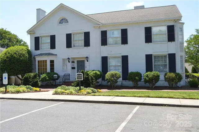 front view of house next to a yard