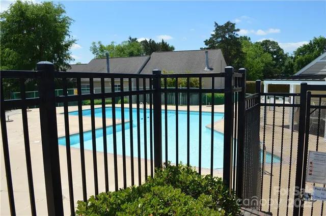 a view of a brick house with a yard