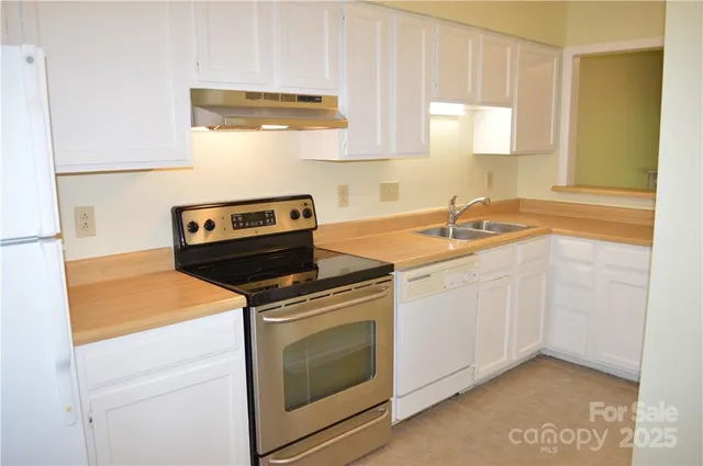a kitchen with a stove and a sink