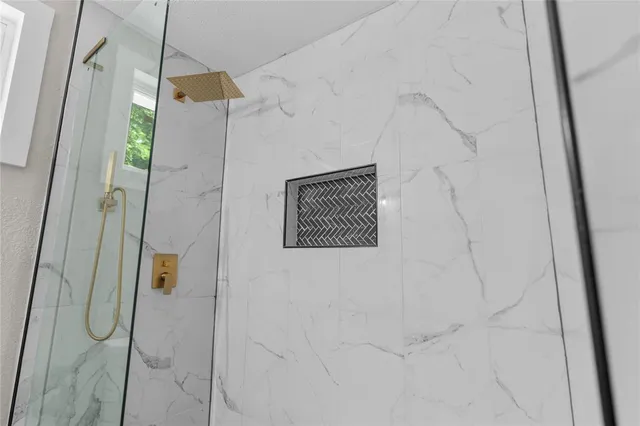 a bathroom with a shower and a shower