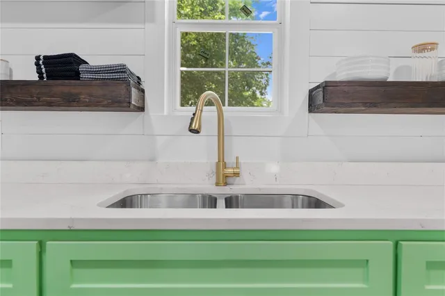 a bathroom with a sink and a window