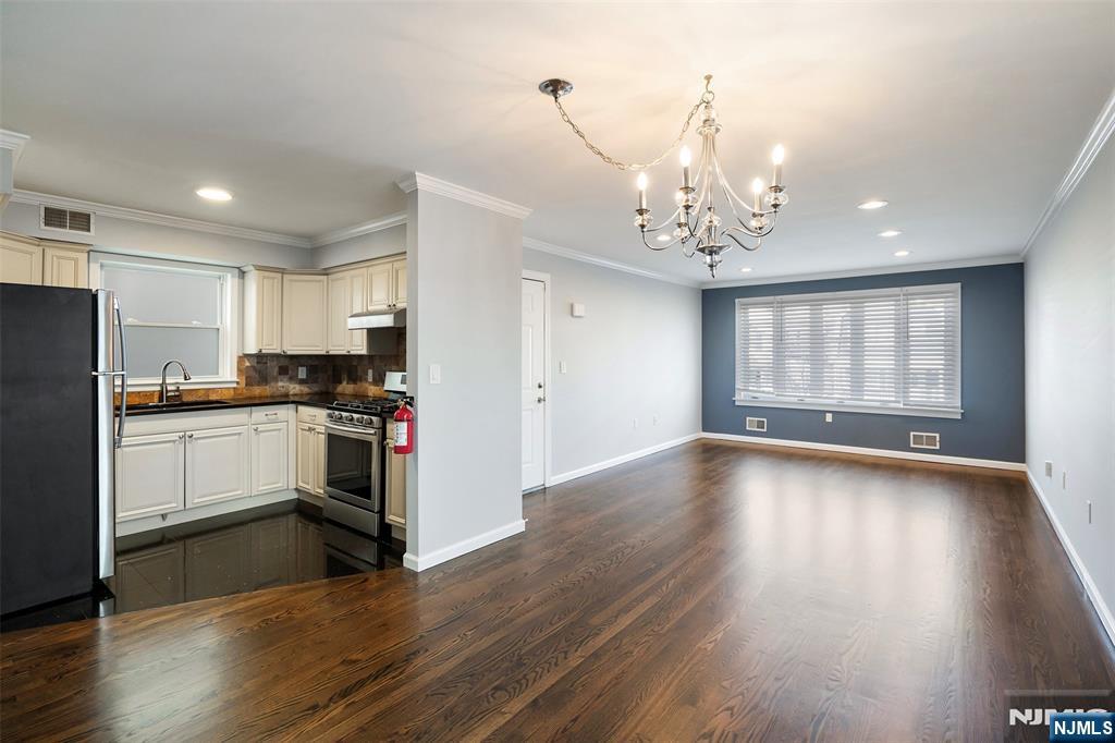 312 Vine Street Elizabeth, NJ 07202 - Photo 4 of 10 a kitchen with a refrigerator and a stove top oven