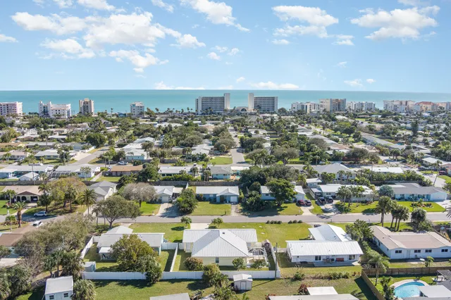 an aerial view of residential building with parking space