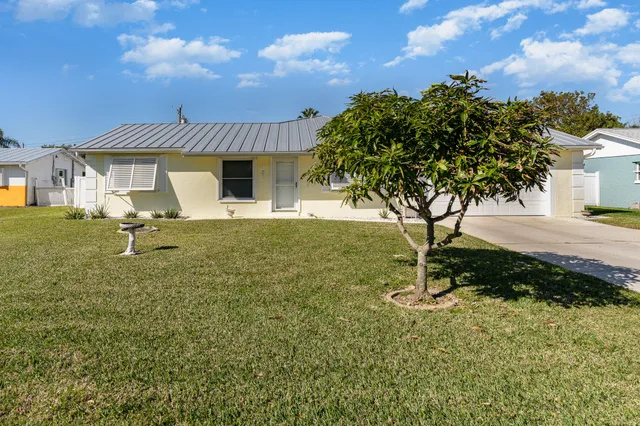 a house view with a garden space