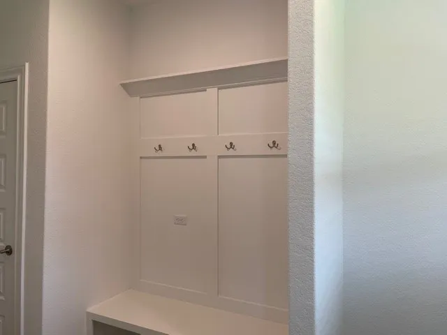 a room that has a window and a wooden floor