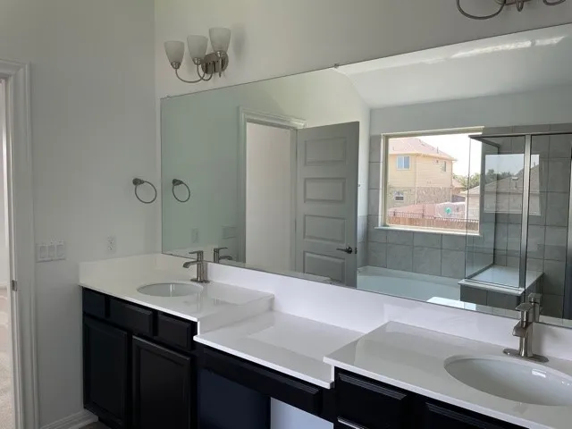 a bathroom with a bathtub and window