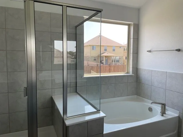 a bathroom with a sink double vanity and a mirror
