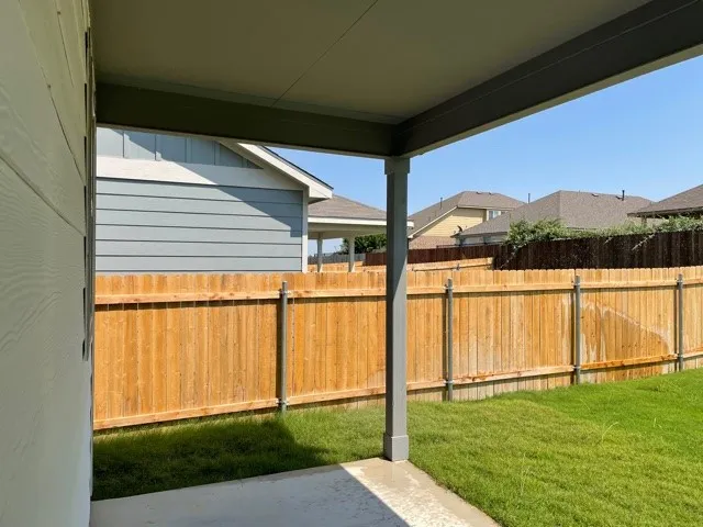 a large kitchen with stainless steel appliances a stove and a sink