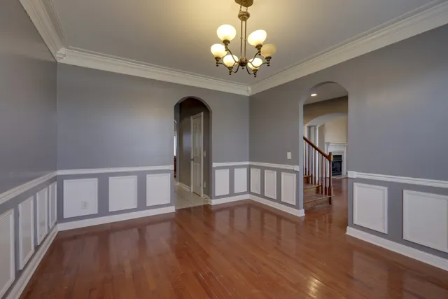 a view of an entryway with wooden floor