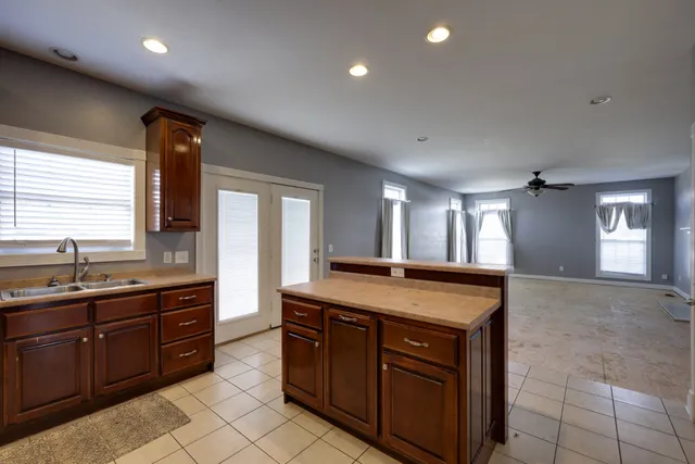a kitchen with a stove and a sink