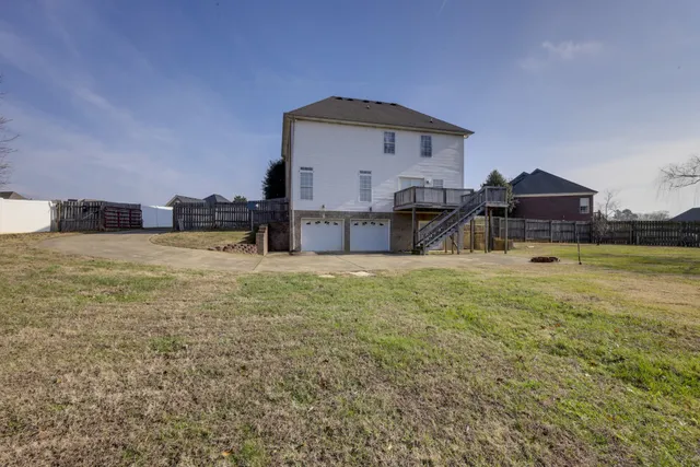 a view of a house with yard and a sink