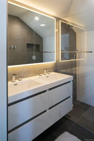 a bathroom with a sink and a mirror