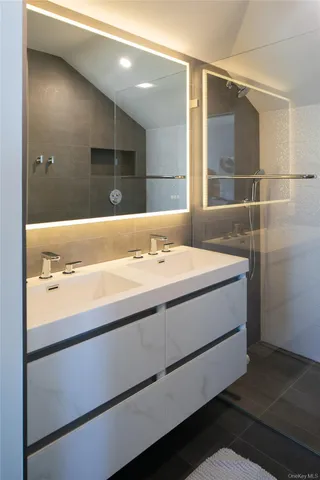 a bathroom with a sink and a mirror