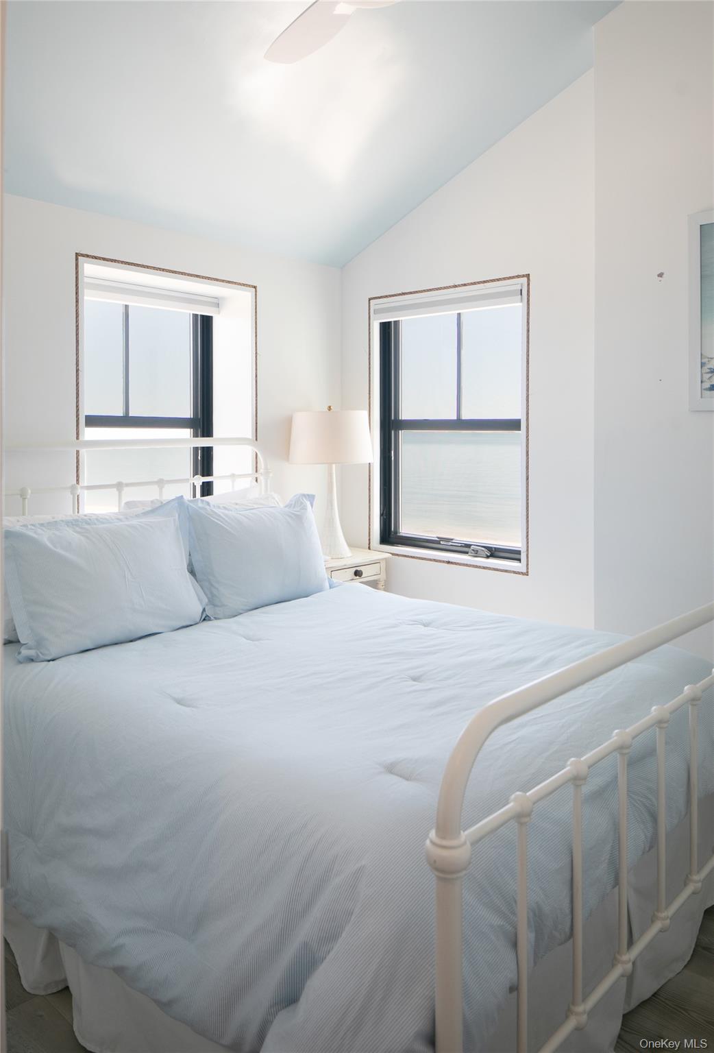 610 Park Avenue Mattituck, NY 11952 - Photo 12 of 23 a bedroom with a large bed and a window