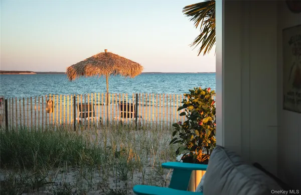 a terrace of a house with outdoor seating