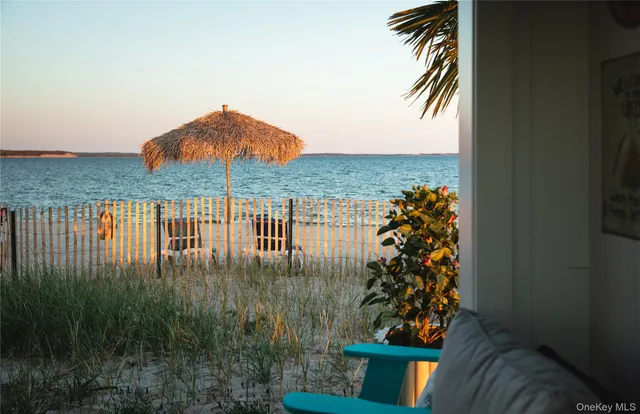 a terrace of a house with outdoor seating
