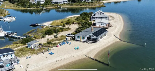 an aerial view of a house with a lake view