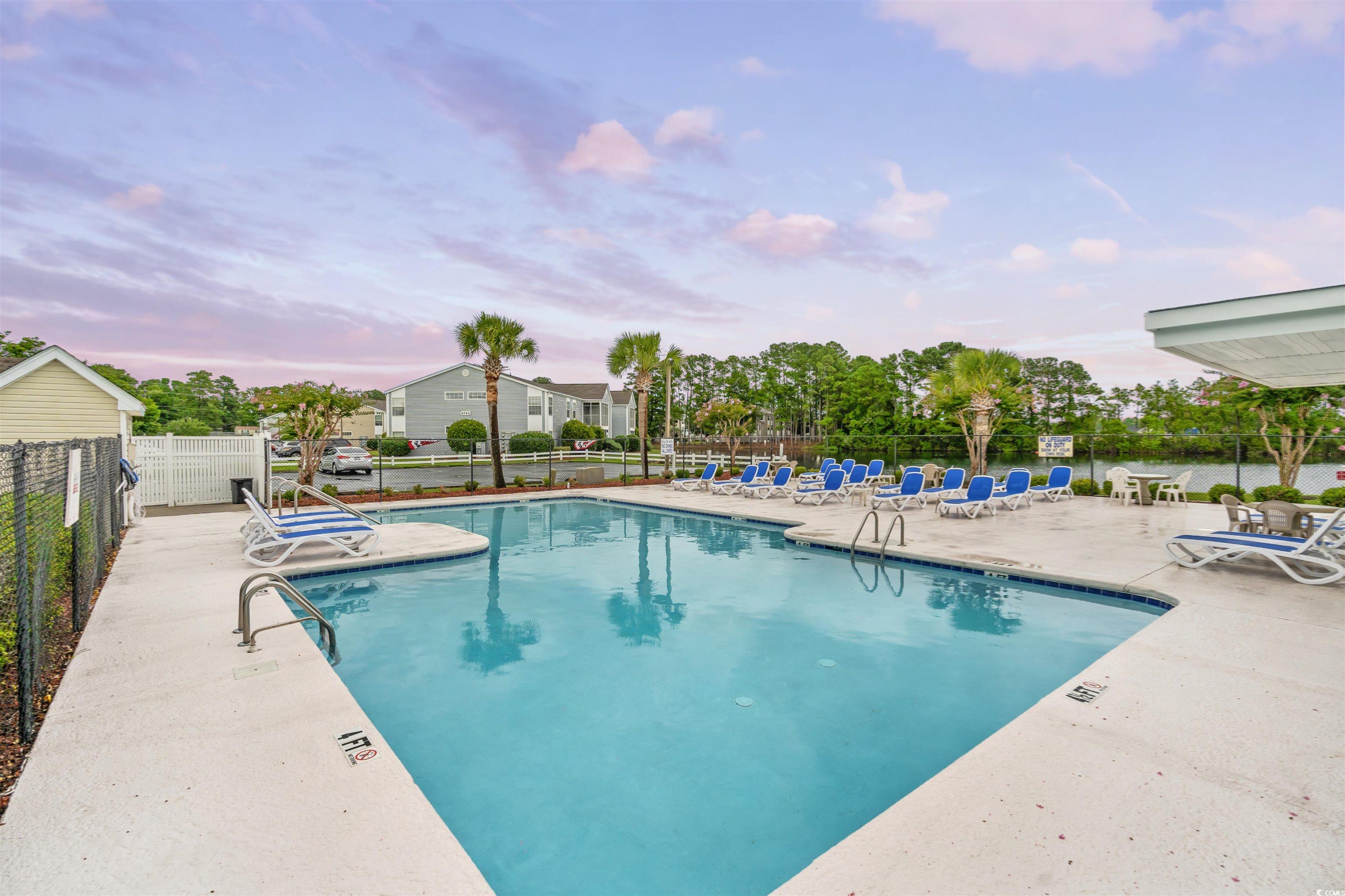 8862 Duckview Drive, Unit E Surfside Beach, SC 29575 - Photo 13 of 16 Community pool featuring a patio
