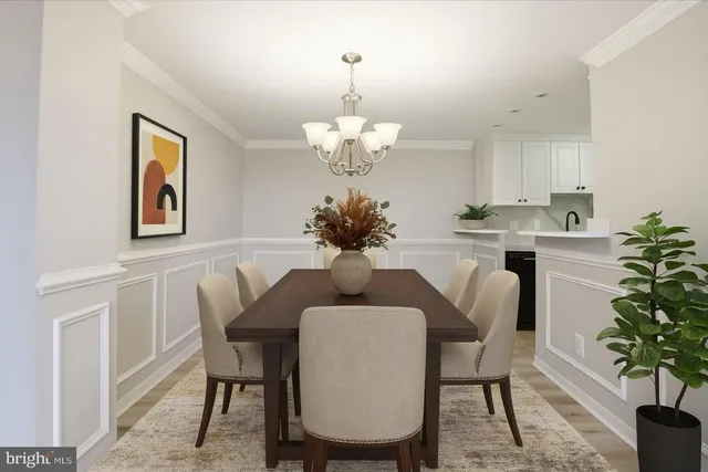 a dining room with furniture and chandelier