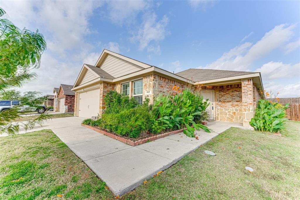 517 Milo Way Royse City, TX 75189 - Photo 22 of 34 Brick exterior with stone accents and an attached garage