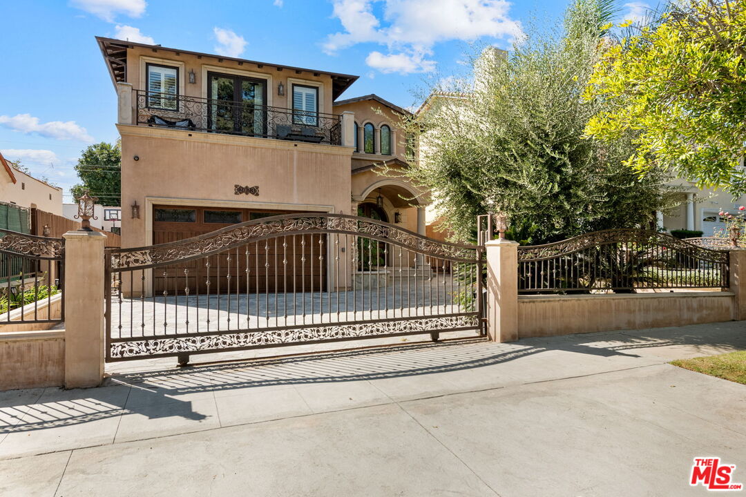 2023 Parnell Avenue Los Angeles, CA 90025 - Photo 1 of 59 a view of a house with a small yard and wooden fence