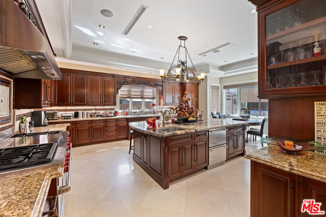 2023 Parnell Avenue Los Angeles, CA 90025 - Photo 13 of 59 a kitchen with stainless steel appliances granite countertop a stove and a sink