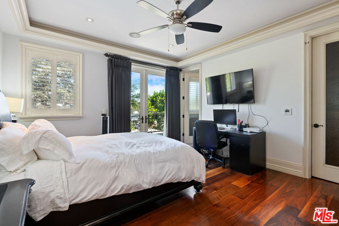 2023 Parnell Avenue Los Angeles, CA 90025 - Photo 24 of 59 a bedroom with a bed and a flat screen tv