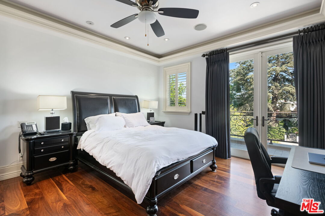 2023 Parnell Avenue Los Angeles, CA 90025 - Photo 25 of 59 a bedroom with a bed and wooden floor
