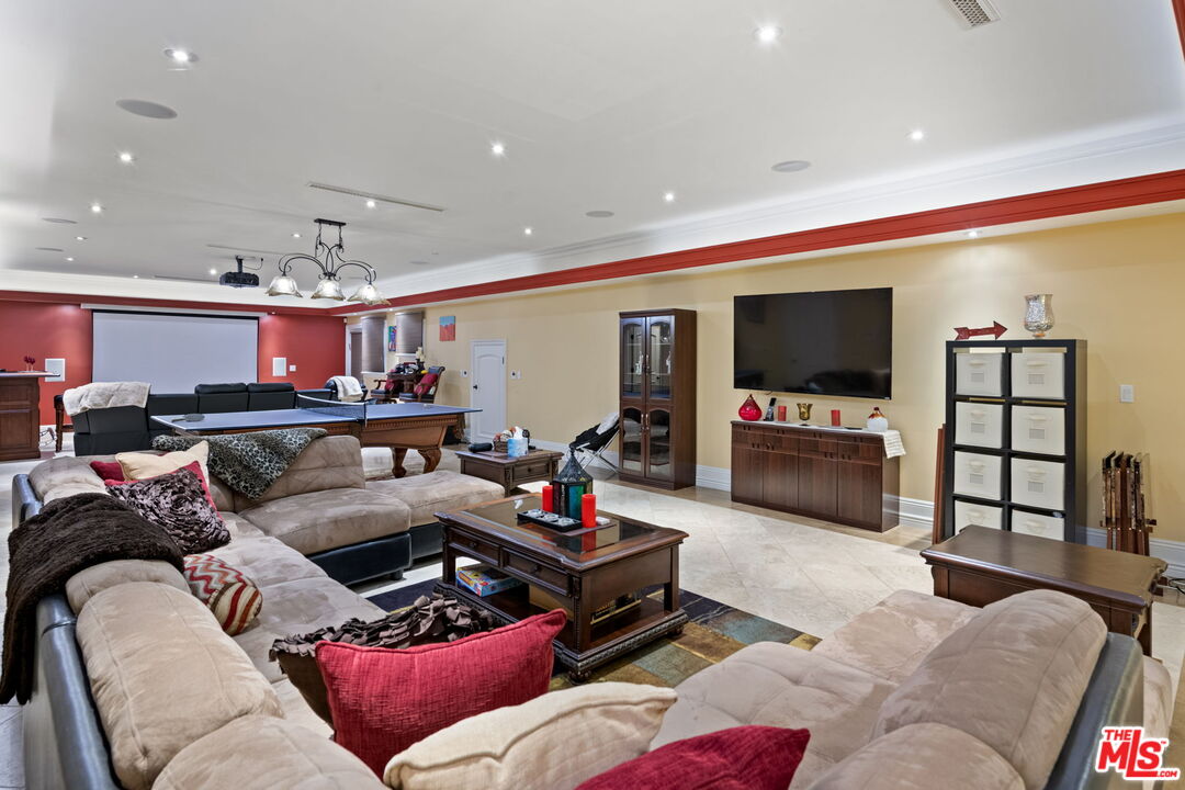2023 Parnell Avenue Los Angeles, CA 90025 - Photo 41 of 59 a living room with furniture and a flat screen tv