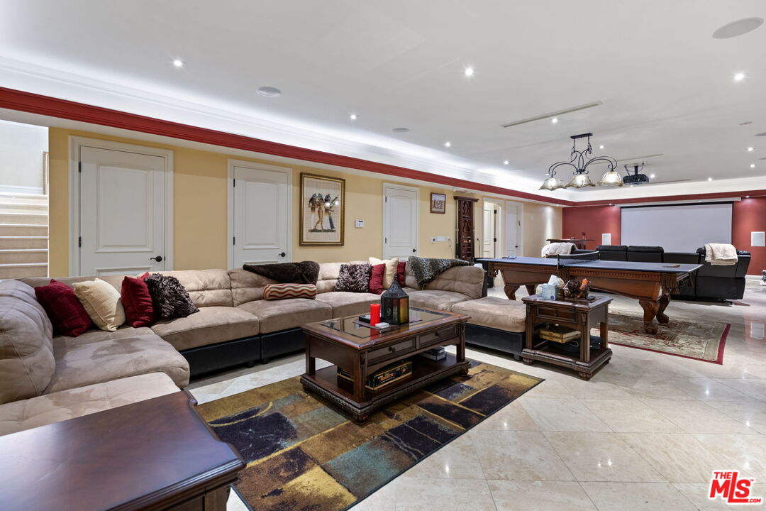 2023 Parnell Avenue Los Angeles, CA 90025 - Photo 42 of 59 a living room with furniture and a chandelier