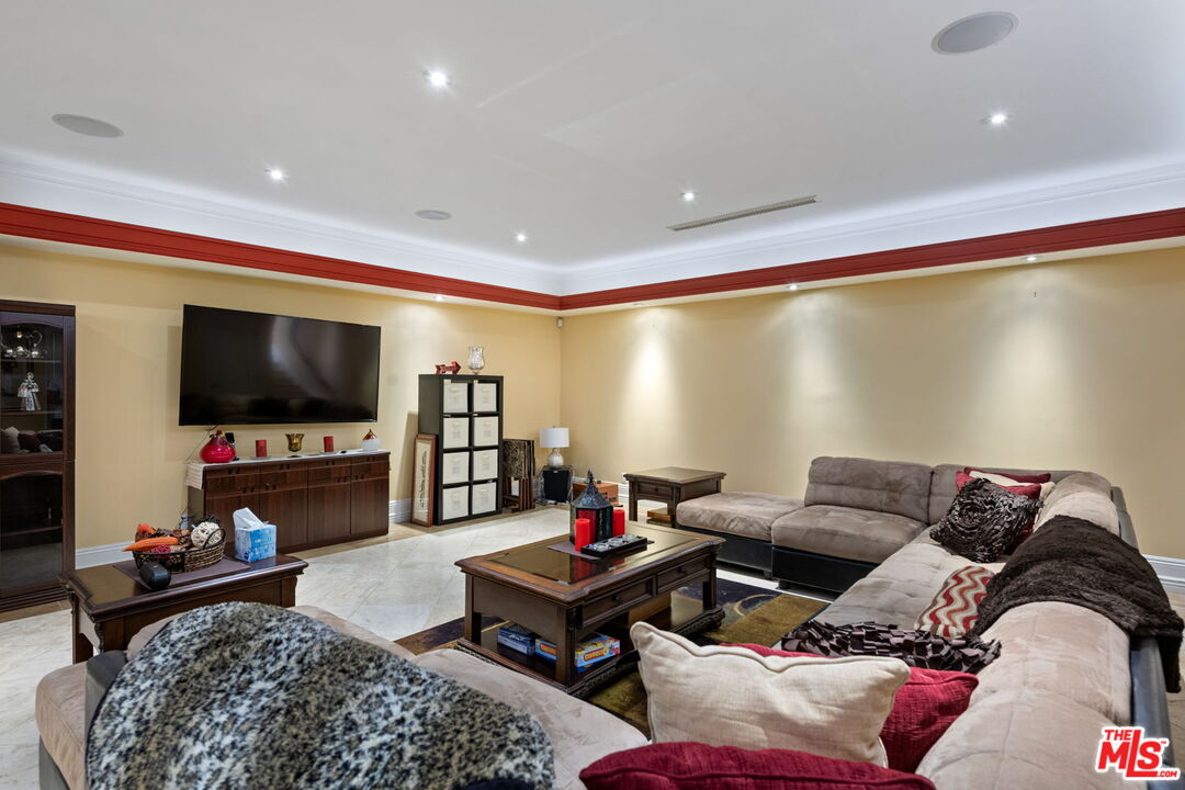 2023 Parnell Avenue Los Angeles, CA 90025 - Photo 43 of 59 a living room with furniture and a flat screen tv