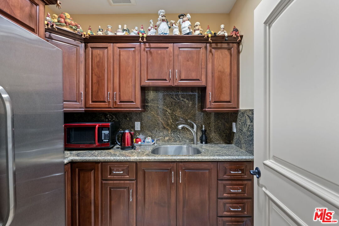 2023 Parnell Avenue Los Angeles, CA 90025 - Photo 47 of 59 a kitchen with stainless steel appliances granite countertop a refrigerator and a sink